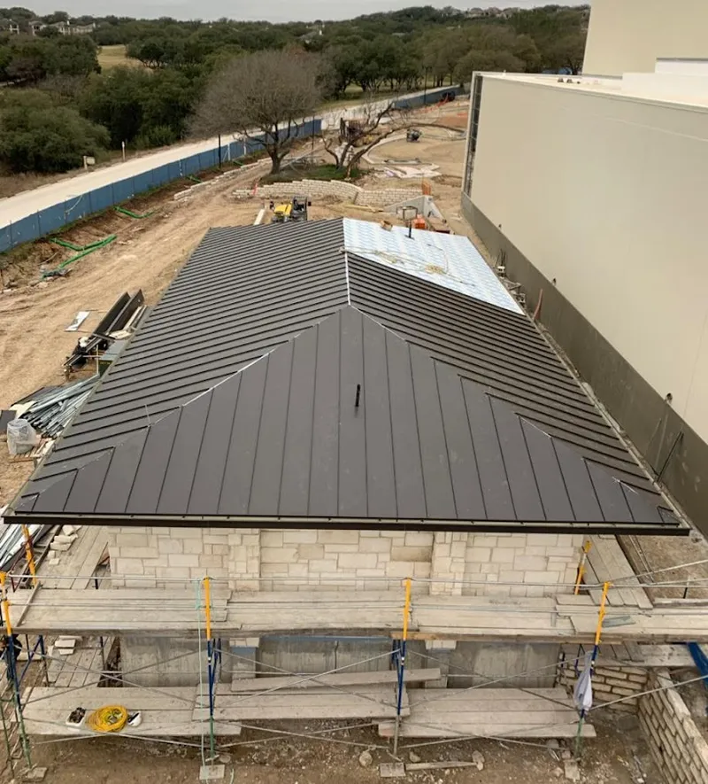 Metal roof new construction with scaffolding in Indiantown